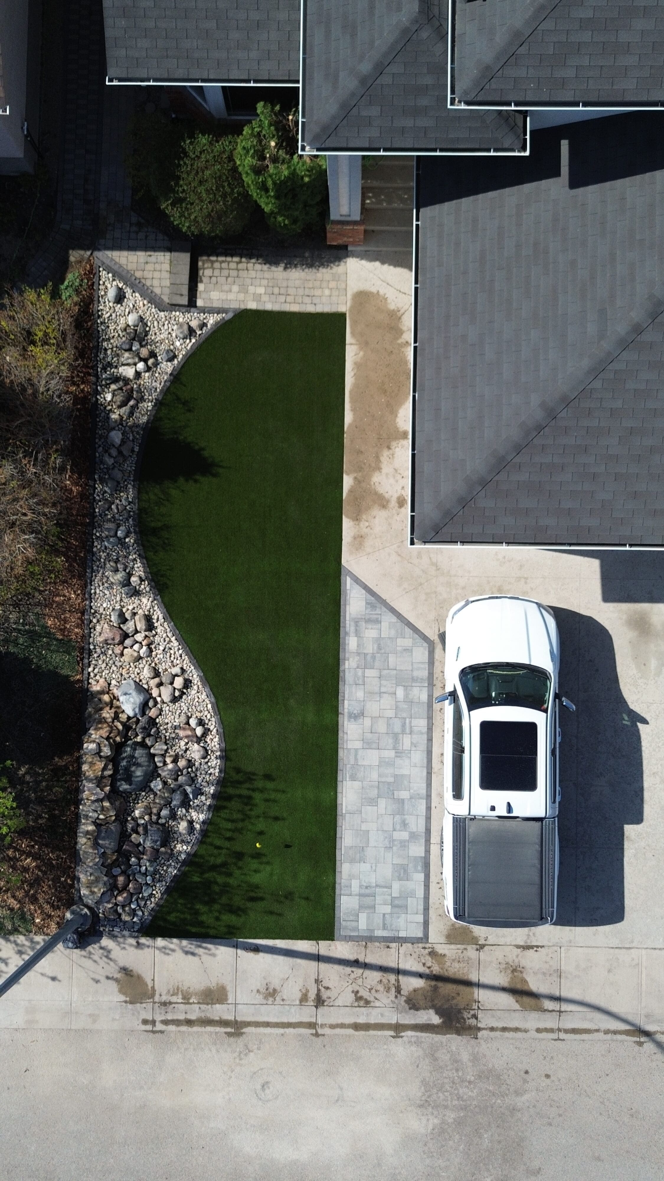 Front yard walkway installation with stone pavers in Regina